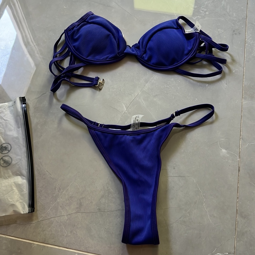 BRAND new. Never worn. Tried on and it was too large
